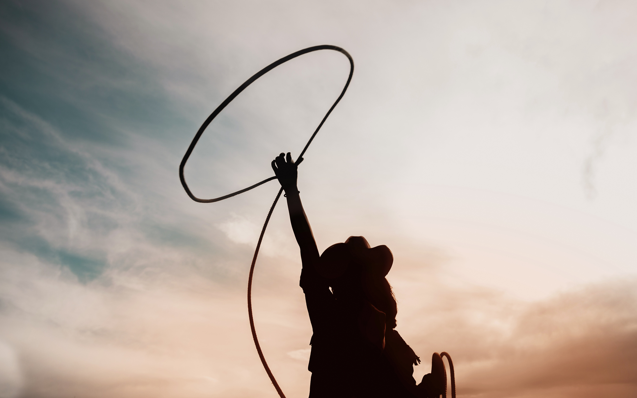 cowgirl throwing a lasso